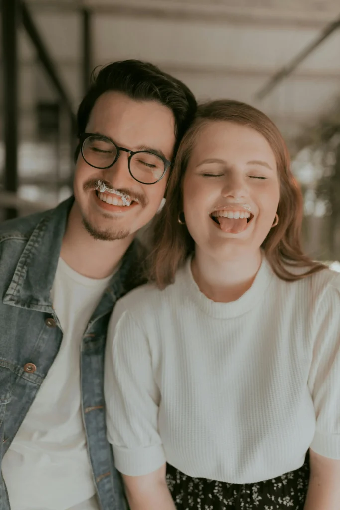 a man and woman with fake food mustaches
